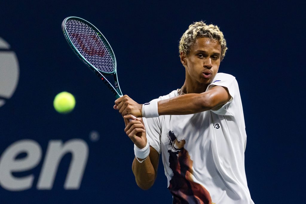 Aug 25, 2025; Flushing, NY, USA; Gabriel Diallo of Canada in action against Damir Dzumhur of Bosnia and Herzegovina in the first round of the men’s singles at the US Open at Billie Jean King National Tennis Centre. Mandatory Credit: Mike Frey-Imagn Images