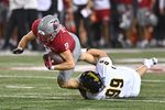Aug 30, 2025; Pullman, Washington, USA; Washington State Cougars running back Kirby Vorhees (9) is tackled in the backfield by Idaho Vandals defensive lineman Trevor Miller (99) in the first half at Gesa Field at Martin Stadium. Mandatory Credit: James Snook-Imagn Images