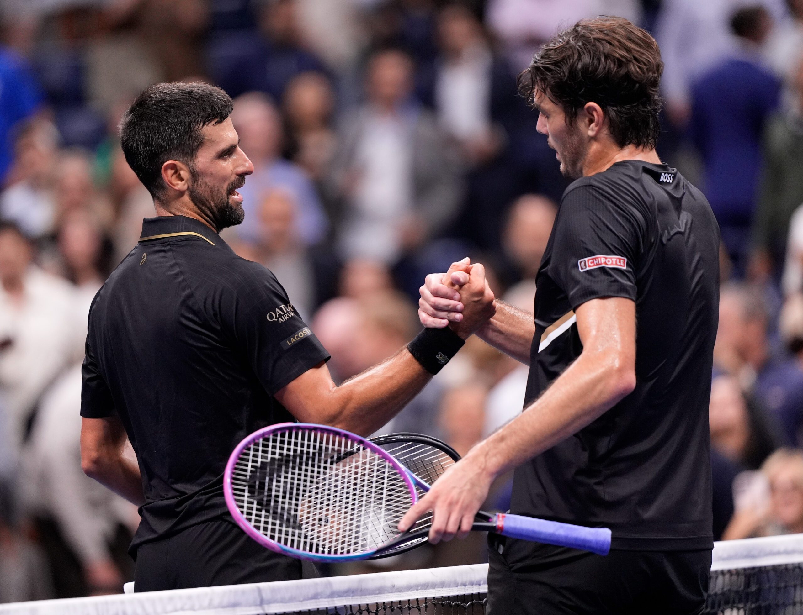 Sep 2, 2025; Flushing, NY, USA;  
Novak Djokovic (SRB) (left) after defeating Taylor Fritz (USA) (right) on day ten of the 2025 U.S. Open tennis tournament at the USTA Billie Jean King National Tennis Center. Mandatory Credit: Robert Deutsch-Imagn Images