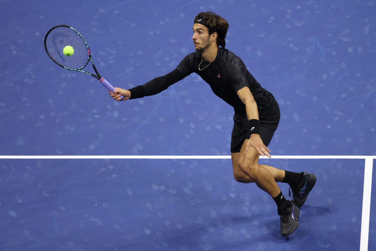 Sep 3, 2025; Flushing, NY, USA; Lorenzo Musetti (ITA) hits a shot against Jannik Sinner (ITA) (not pictured) on day eleven of the 2025 US Open tennis championships at USTA Billie Jean King National Tennis Center. Mandatory Credit: Mike Frey-Imagn Images