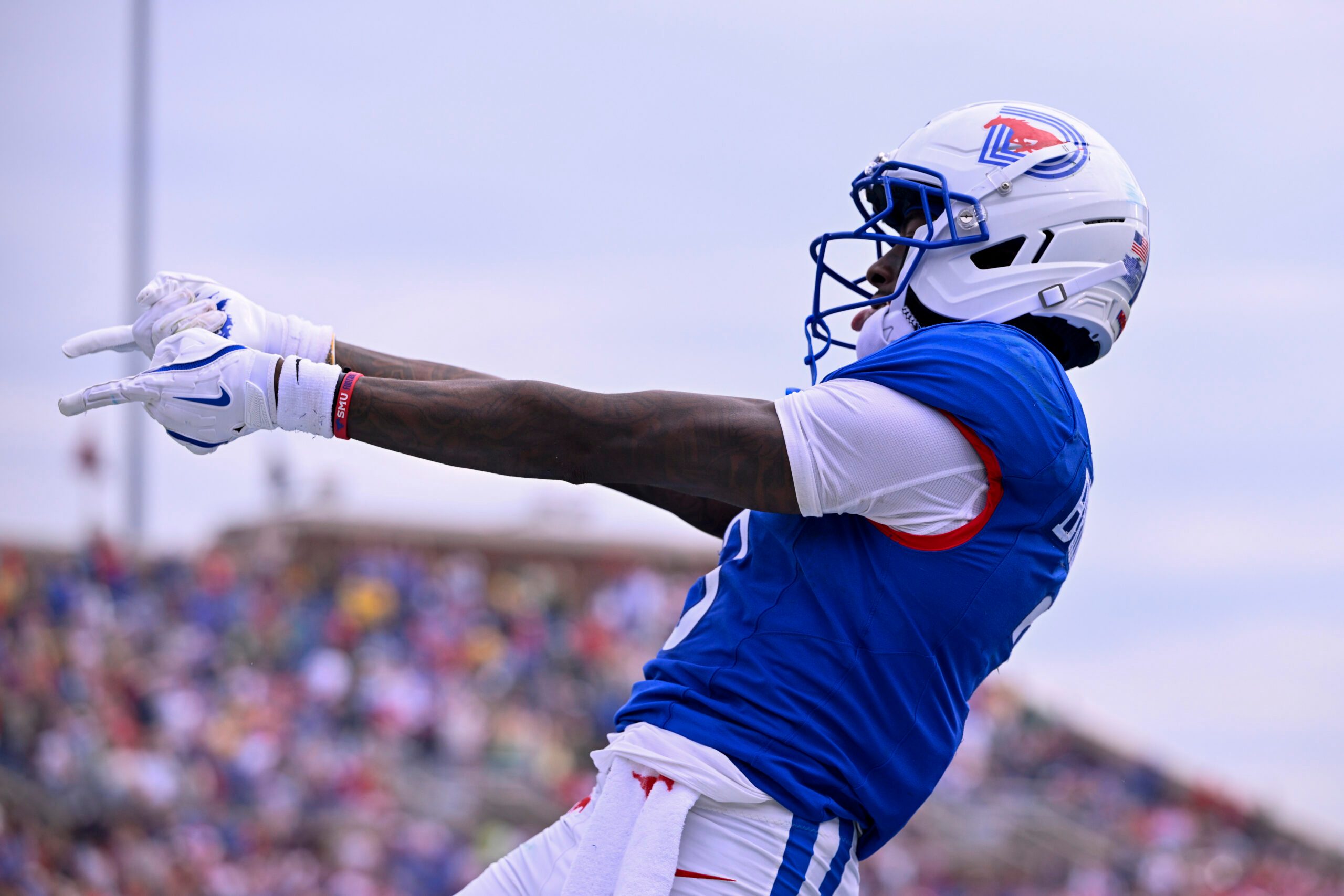 Sep 6, 2025; Dallas, Texas, USA; SMU Mustangs wide receiver Romello Brinson (3) celebrates after he scores a touchdown during the first overtime against the Baylor Bears at Gerald J. Ford Stadium. Mandatory Credit: Jerome Miron-Imagn Images