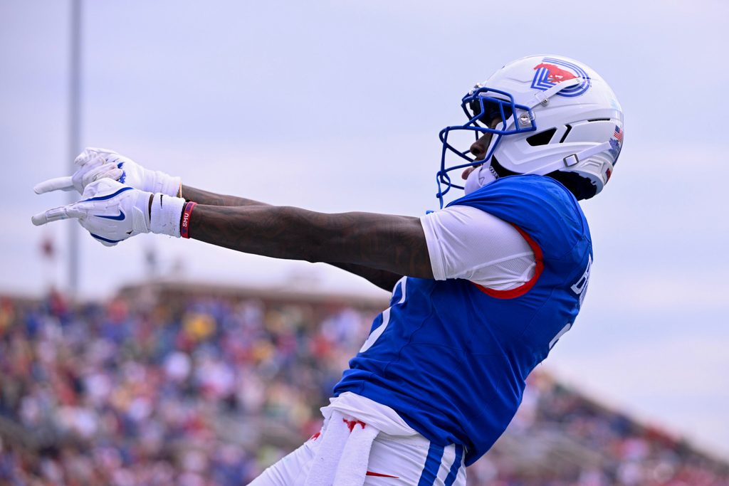 Sep 6, 2025; Dallas, Texas, USA; SMU Mustangs wide receiver Romello Brinson (3) celebrates after he scores a touchdown during the first overtime against the Baylor Bears at Gerald J. Ford Stadium. Mandatory Credit: Jerome Miron-Imagn Images