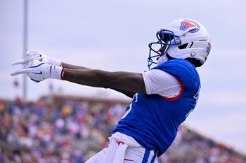 Sep 6, 2025; Dallas, Texas, USA; SMU Mustangs wide receiver Romello Brinson (3) celebrates after he scores a touchdown during the first overtime against the Baylor Bears at Gerald J. Ford Stadium. Mandatory Credit: Jerome Miron-Imagn Images
