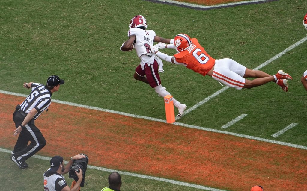Troy Trojans receiver Tray Taylor (8) scores a touchdown near Clemson cornerback Ricardo Jones (6) during the first quarter at Memorial Stadium in Clemson, S.C. Saturday, September 6, 2025.