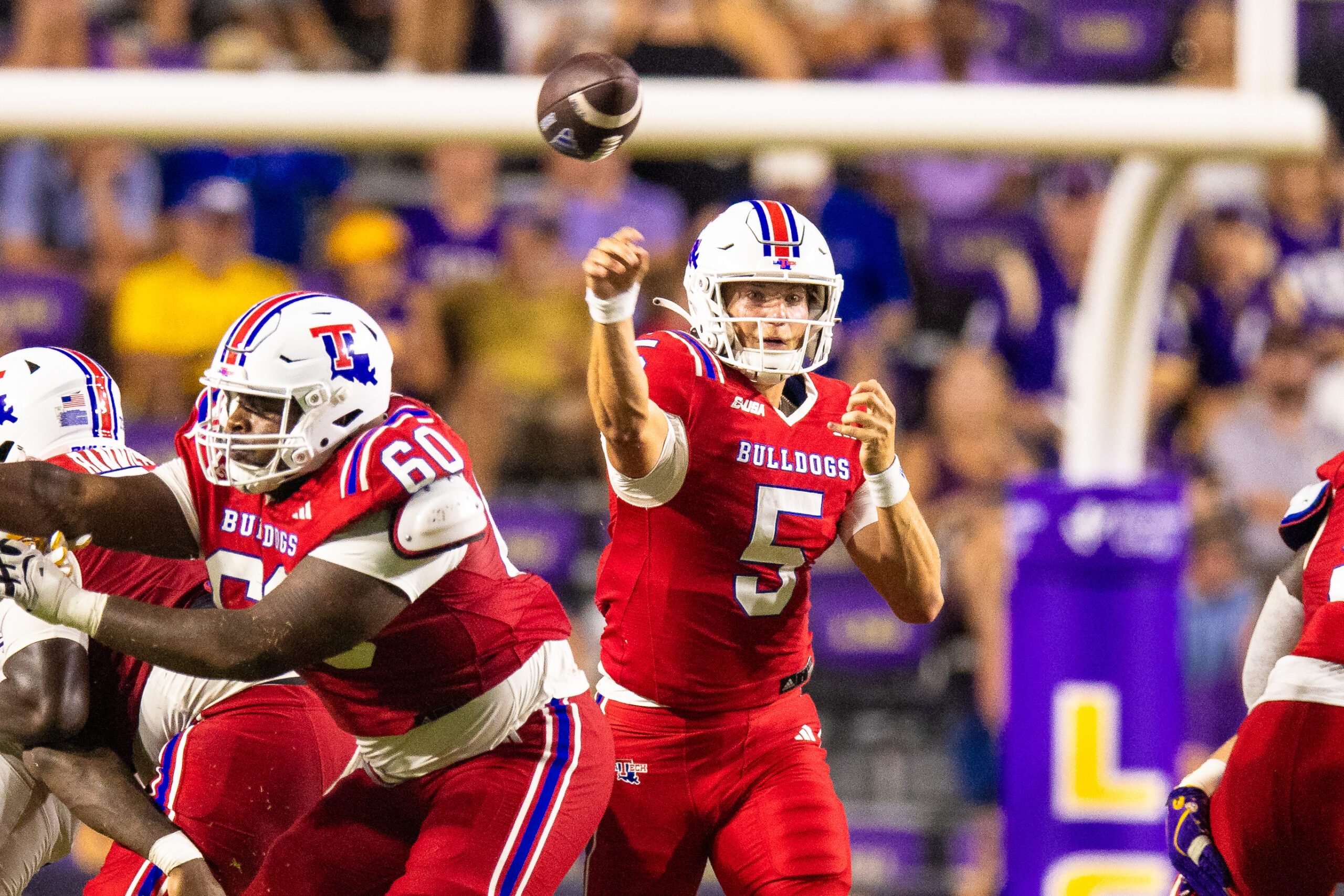 Sep 6, 2025; Baton Rouge, Louisiana, USA;  Louisiana Tech Bulldogs quarterback Blake Baker (5) passes against LSU Tigers during the second half  at Tiger Stadium. Mandatory Credit: Stephen Lew-Imagn Images
