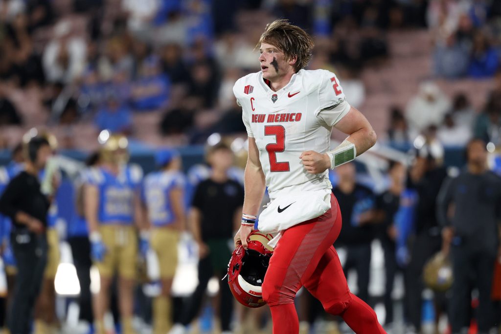 Sep 12, 2025; Pasadena, California, USA; New Mexico Lobos quarterback Jack Layne (2) runs back to the sideline during the second quarter against the UCLA Bruins at Rose Bowl. Mandatory Credit: Kiyoshi Mio-Imagn Images