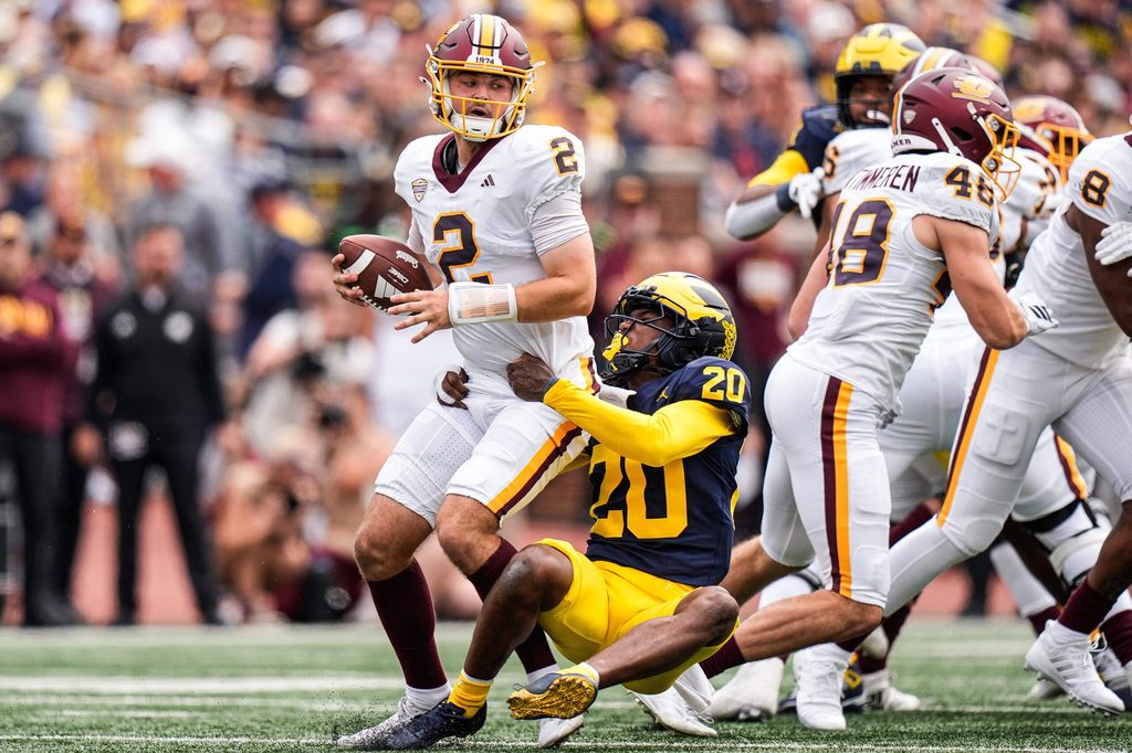 Michigan defensive back Jyaire Hill (20) sacks Central Michigan quarterback Joe Labas (2) during the first half at Michigan Stadium in Ann Arbor on Saturday, Sept. 13, 2025.