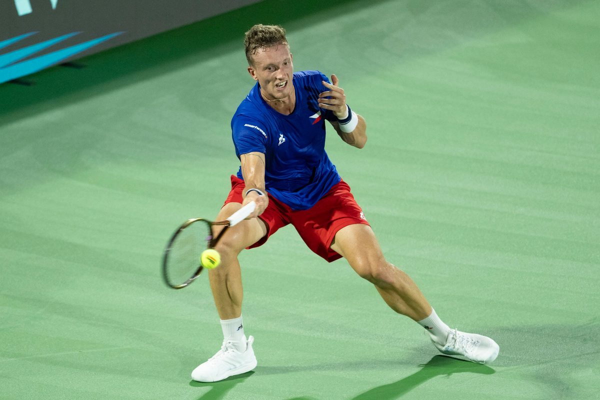 Sep 13, 2025; Delray Beach, FL, USA; Jiri Lehecka of Czechia returns a shot against Taylor Fritz of the United States in their Davis Cup match at Delray Beach Tennis Center. Mandatory Credit: Susan Mullane-Imagn Images