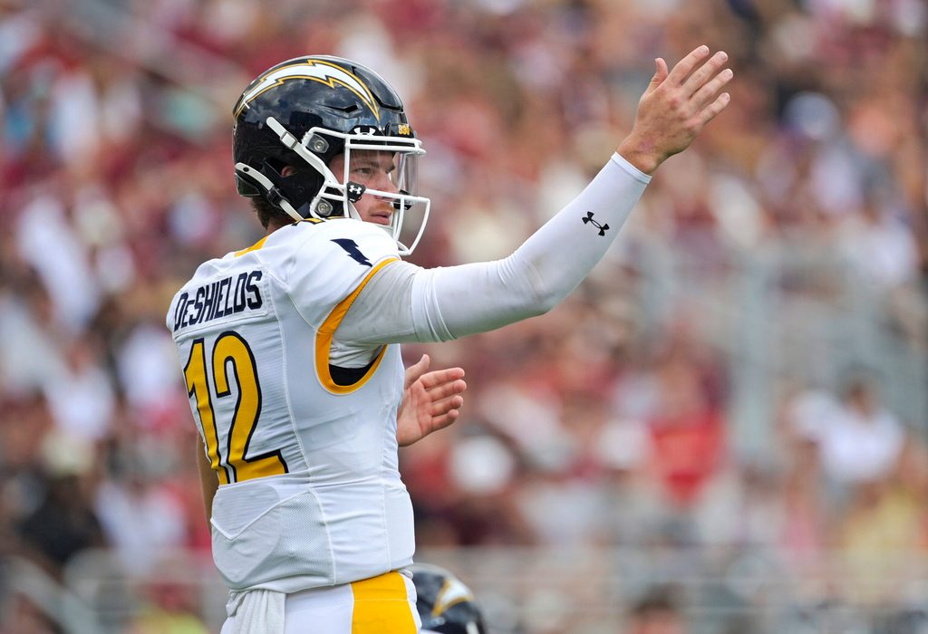 Sep 20, 2025; Tallahassee, Florida, USA; Kent State Golden Flashes quarterback Dru DeShields (12) directs players at the line during the first half against the Florida State Seminoles at Doak S. Campbell Stadium. Mandatory Credit: Melina Myers-Imagn Images