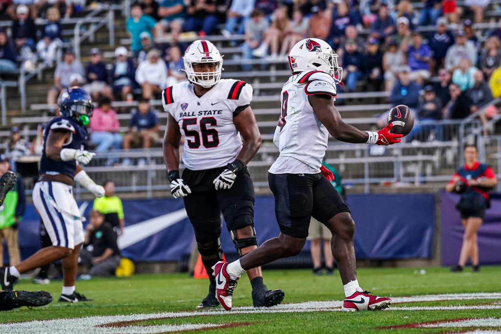 Sep 20, 2025; East Hartford, Connecticut, USA; Ball State Cardinals running back Qua Ashley (9) runs the ball for a touchdown against the Connecticut Huskies in the second half at Pratt & Whitney Stadium at Rentschler Field. Mandatory Credit: David Butler II-Imagn Images