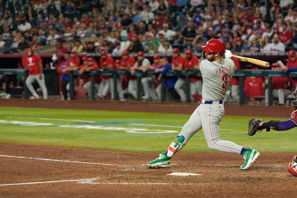 Sep 21, 2025; Phoenix, Arizona, USA; Philadelphia Phillies infielder Bryce Harper (3) singles on a sharp line drive to center in the ninth inning against the Arizona Diamondbacks at Chase Field. Mandatory Credit: Allan Henry-Imagn Images