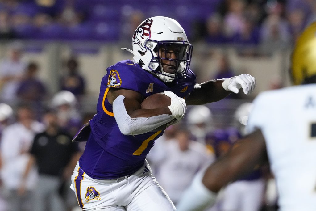 Sep 25, 2025; Greenville, North Carolina, USA; East Carolina Pirates running back London Montgomery (7) runs with the ball against the Army Black Knights during the first half at Dowdy-Ficklen Stadium. Mandatory Credit: James Guillory-Imagn Images