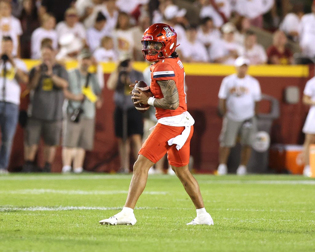 Sep 27, 2025; Ames, Iowa, USA; Arizona Wildcats quarterback Noah Fifita (1) looks to pass against the Iowa State Cyclones during the first half at Jack Trice Stadium. Mandatory Credit: Reese Strickland-Imagn Images