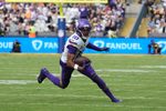 Sep 28, 2025; Dublin, Ireland; Minnesota Vikings wide receiver Justin Jefferson (18) runs for a gain during the second quarter against the Pittsburgh Steelers during an NFL International Series game at Croke Park. Mandatory Credit: Kirby Lee-Imagn Images