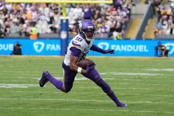 Sep 28, 2025; Dublin, Ireland; Minnesota Vikings wide receiver Justin Jefferson (18) runs for a gain during the second quarter against the Pittsburgh Steelers during an NFL International Series game at Croke Park. Mandatory Credit: Kirby Lee-Imagn Images