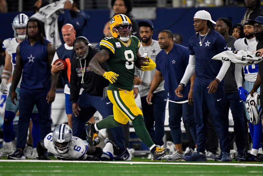Sep 28, 2025; Arlington, Texas, USA; Green Bay Packers running back Josh Jacobs (8) runs with the ball during the game between the Dallas Cowboys and the Green Bay Packers at AT&T Stadium. Mandatory Credit: Jerome Miron-Imagn Images
