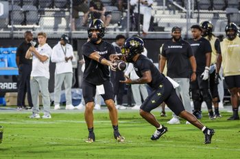Oct 4, 2025; Orlando, Florida, USA; UCF Knights quarterback Tayven Jackson (2) warms up before the game against the Kansas Jayhawks at FBC Mortgage Stadium. Mandatory Credit: Mike Watters-Imagn Images