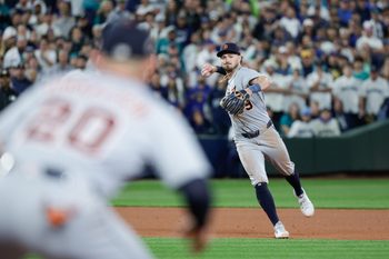 Oct 4, 2025; Seattle, Washington, USA; Detroit Tigers third baseman Zach McKinstry (39) throws to first base for a ground out in the eleventh inning against the Seattle Mariners during game one of the ALDS round for the 2025 MLB playoffs at T-Mobile Park. Mandatory Credit: Joe Nicholson-Imagn Images