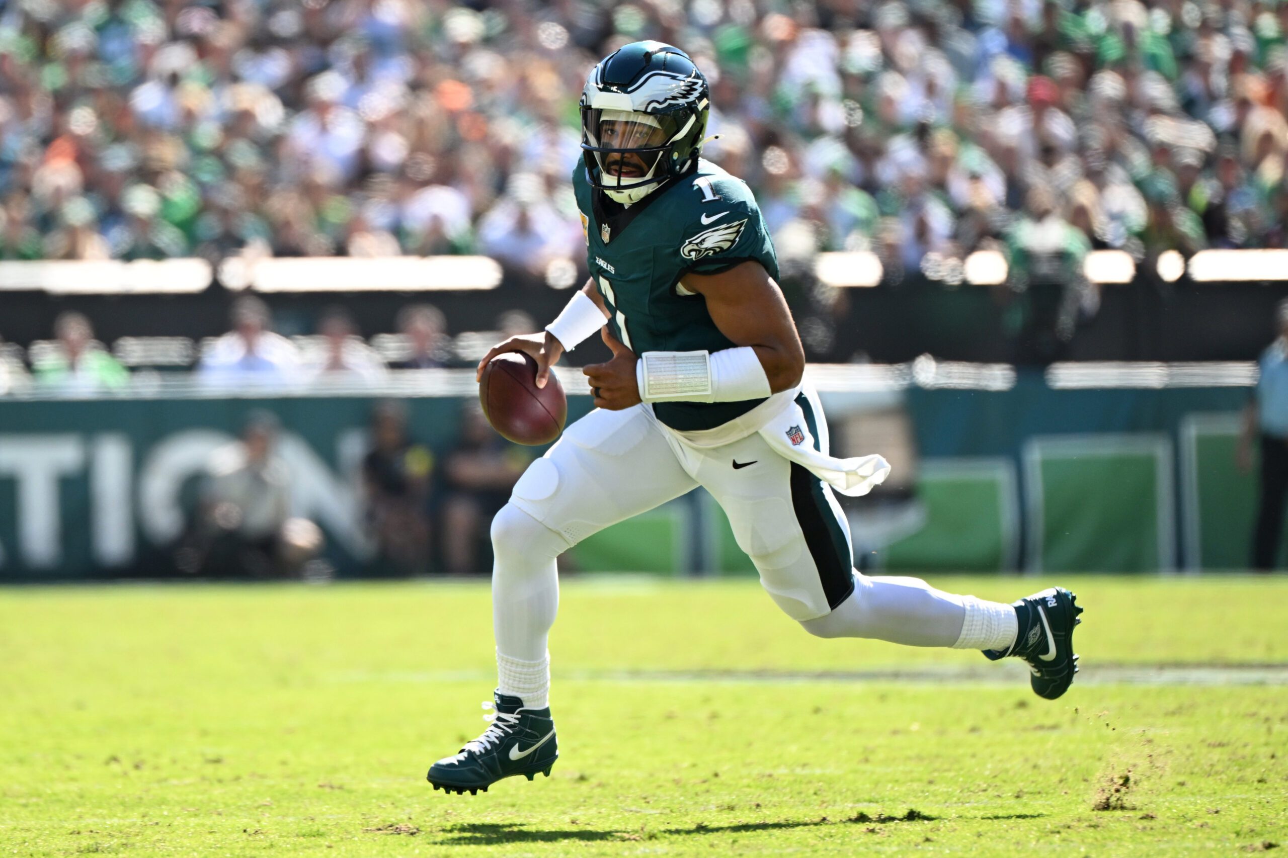 Oct 5, 2025; Philadelphia, Pennsylvania, USA; Philadelphia Eagles quarterback Jalen Hurts (1) runs against the Denver Broncos in the first quarter at Lincoln Financial Field. Mandatory Credit: Eric Hartline-Imagn Images