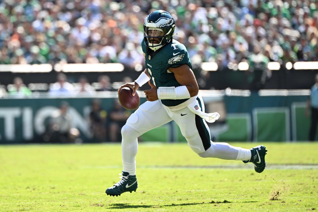Oct 5, 2025; Philadelphia, Pennsylvania, USA; Philadelphia Eagles quarterback Jalen Hurts (1) runs against the Denver Broncos in the first quarter at Lincoln Financial Field. Mandatory Credit: Eric Hartline-Imagn Images