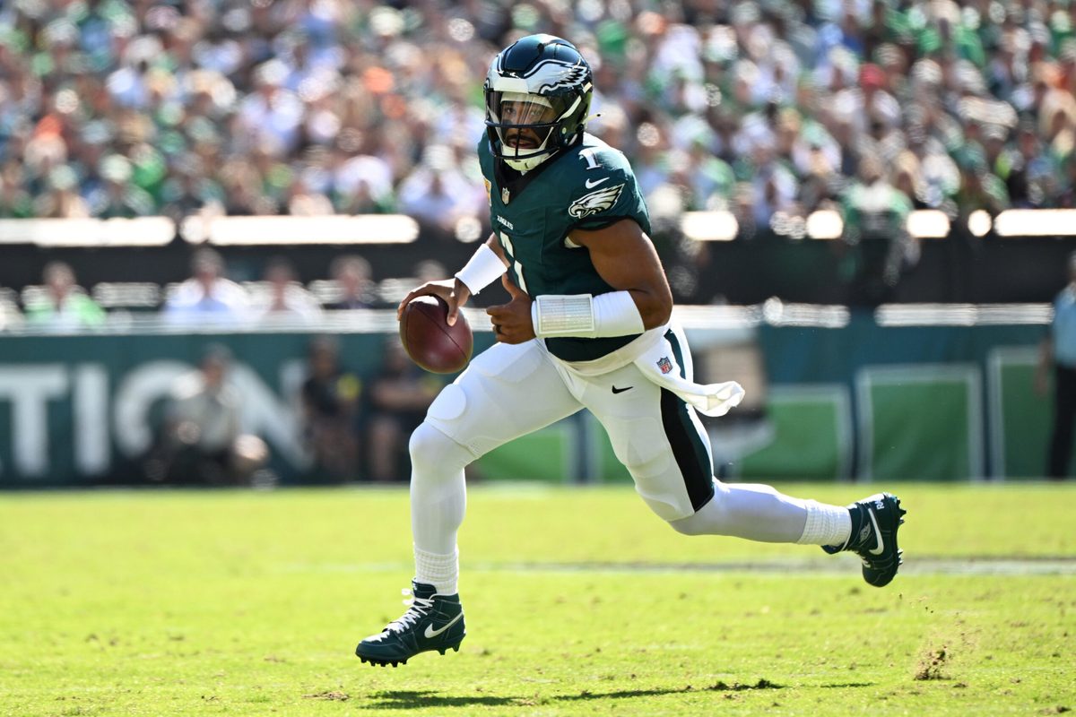 Oct 5, 2025; Philadelphia, Pennsylvania, USA; Philadelphia Eagles quarterback Jalen Hurts (1) runs against the Denver Broncos in the first quarter at Lincoln Financial Field. Mandatory Credit: Eric Hartline-Imagn Images