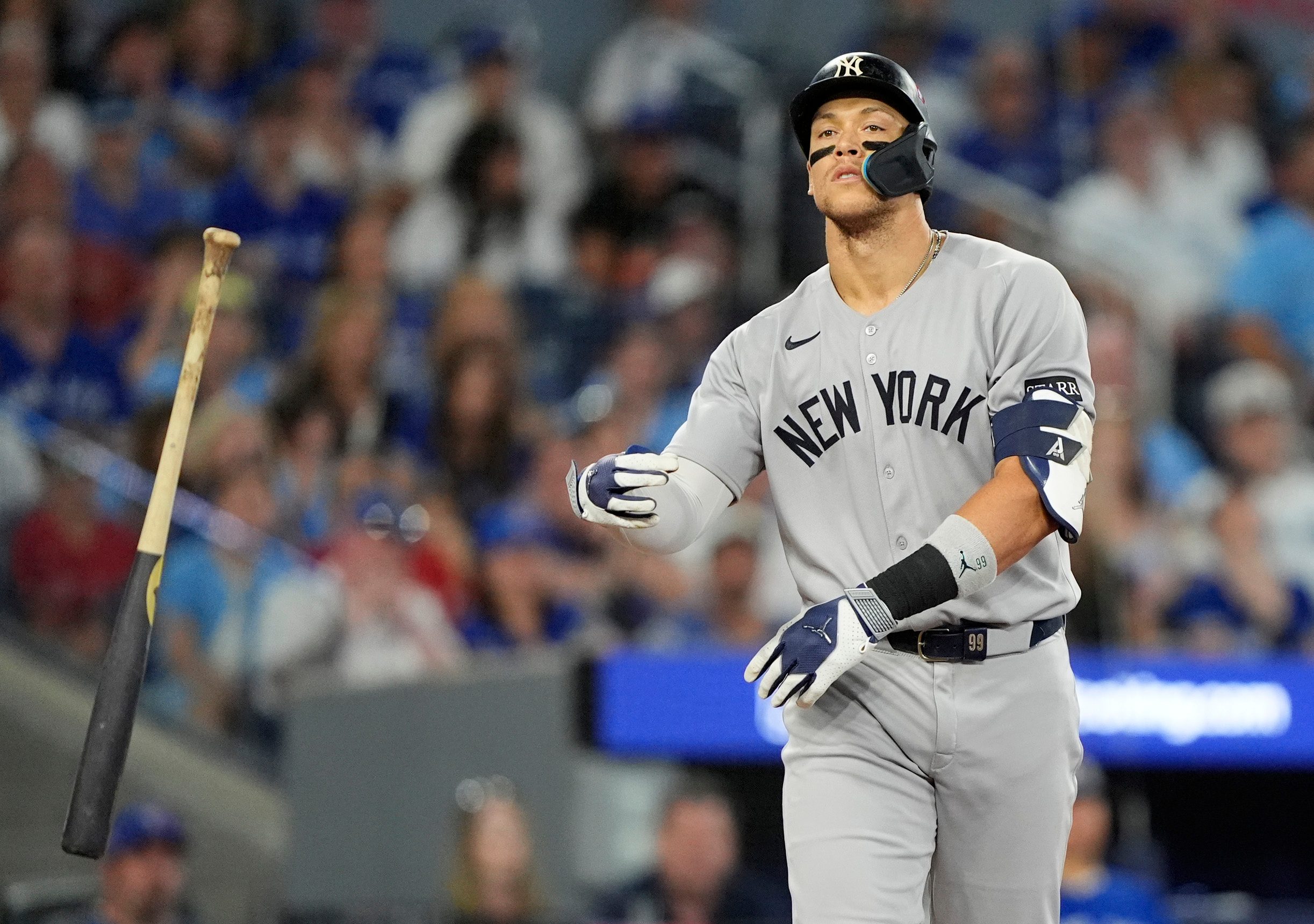 Oct 5, 2025; Toronto, Ontario, CAN; New York Yankees right fielder Aaron Judge (99) reacts after a walk in the ninth inning against the Toronto Blue Jays during game two of the ALDS round for the 2025 MLB playoffs at Rogers Centre. Mandatory Credit: John E. Sokolowski-Imagn Images