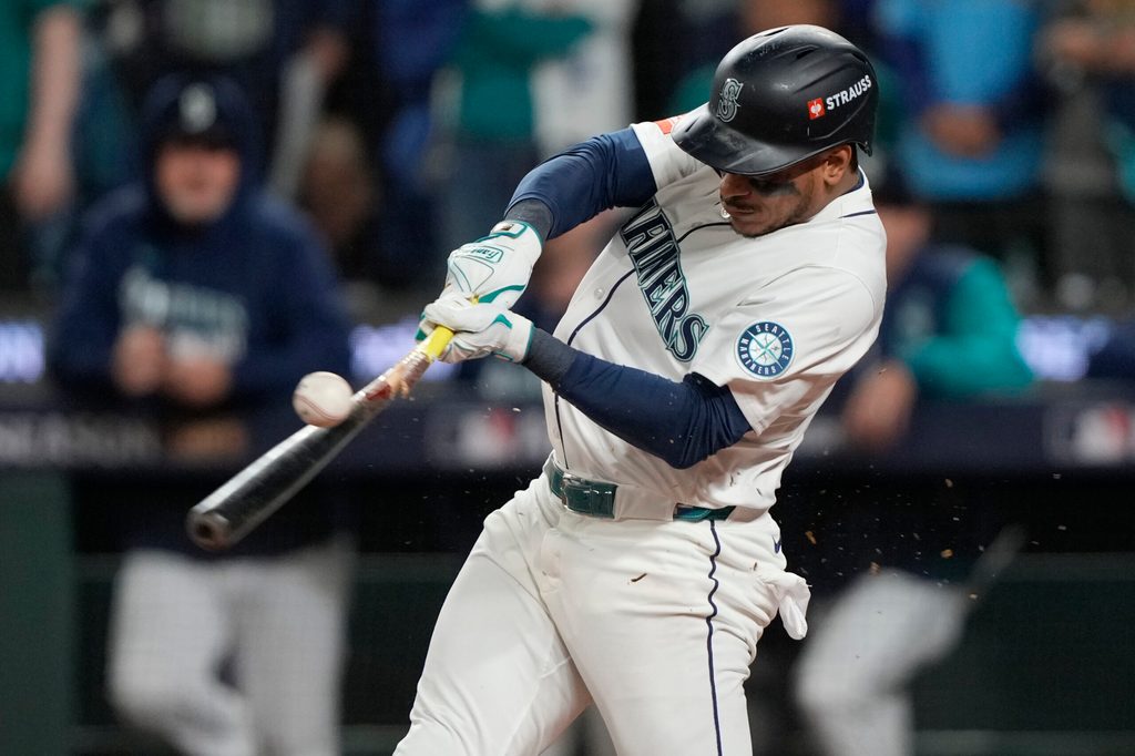 Oct 5, 2025; Seattle, Washington, USA; Seattle Mariners second baseman Jorge Polanco (7) hits a single against the Detroit Tigers in the eighth inning during game two of the ALDS round for the 2025 MLB playoffs at T-Mobile Park. Mandatory Credit: Stephen Brashear-Imagn Images