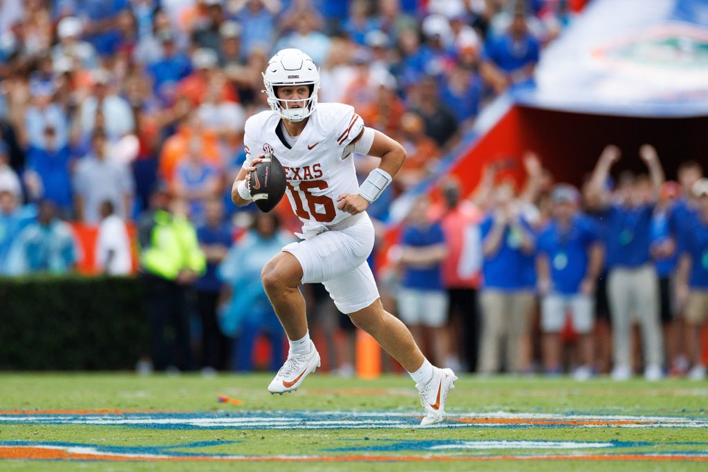 Oct 4, 2025; Gainesville, Florida, USA; Texas Longhorns quarterback Arch Manning (16) runs with the ball against the Florida Gators during the first half at Ben Hill Griffin Stadium. Mandatory Credit: Matt Pendleton-Imagn Images