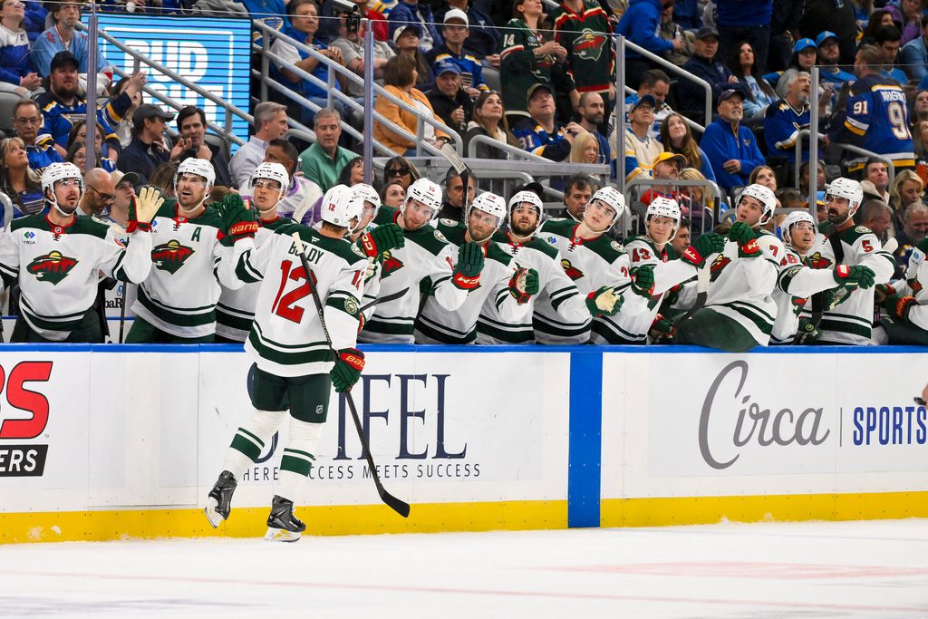 Oct 9, 2025; St. Louis, Missouri, USA; Minnesota Wild left wing Matt Boldy (12) is congratulated by teammates after scoring against the St. Louis Blues during the first period at Enterprise Center. Mandatory Credit: Jeff Curry-Imagn Images
