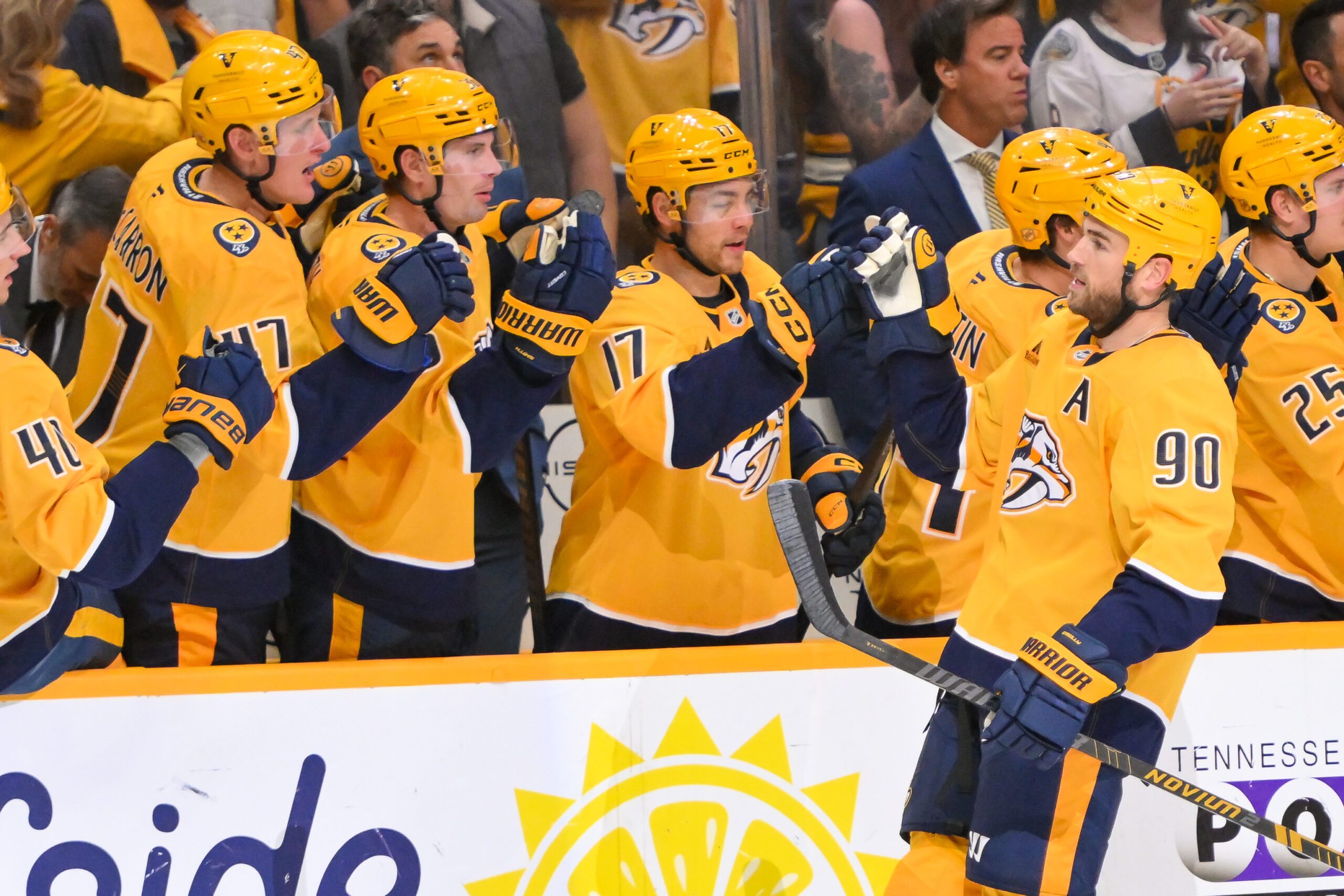 Oct 9, 2025; Nashville, Tennessee, USA; Nashville Predators center Ryan O'Reilly (90) celebrates with his teammates after scoring a goal against the Columbus Blue Jackets during the third period at Bridgestone Arena. Mandatory Credit: Steve Roberts-Imagn Images