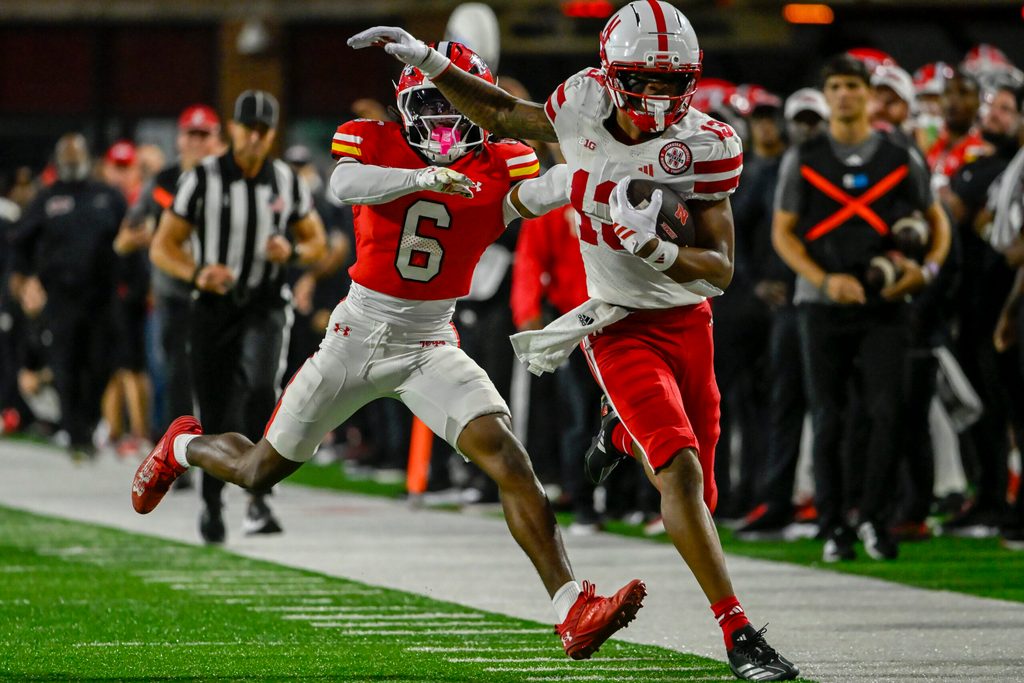 Oct 11, 2025; College Park, Maryland, USA; Nebraska Cornhuskers wide receiver Nyziah Hunter (13) runs for a first down as Maryland Terrapins defensive back Dontay Joyner (6) defends during the second half at SECU Stadium. Mandatory Credit: Tommy Gilligan-Imagn Images
