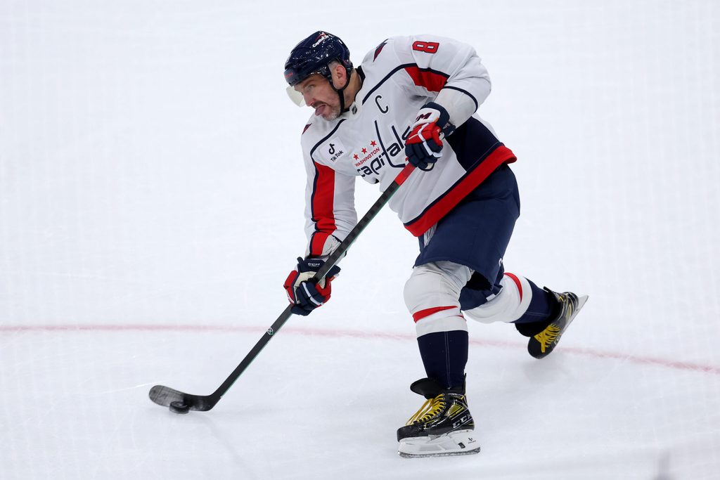 Oct 11, 2025; Elmont, New York, USA; Washington Capitals left wing Alex Ovechkin (8) takes a shot against the New York Islanders during the first period at UBS Arena. Mandatory Credit: Brad Penner-Imagn Images