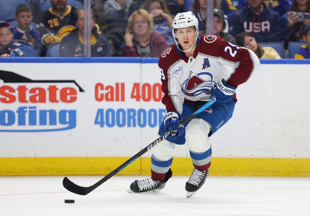 Oct 13, 2025; Buffalo, New York, USA; Colorado Avalanche center Nathan MacKinnon (29) looks to make a pass during the third period against the Buffalo Sabres at KeyBank Center. Mandatory Credit: Timothy T. Ludwig-Imagn Images