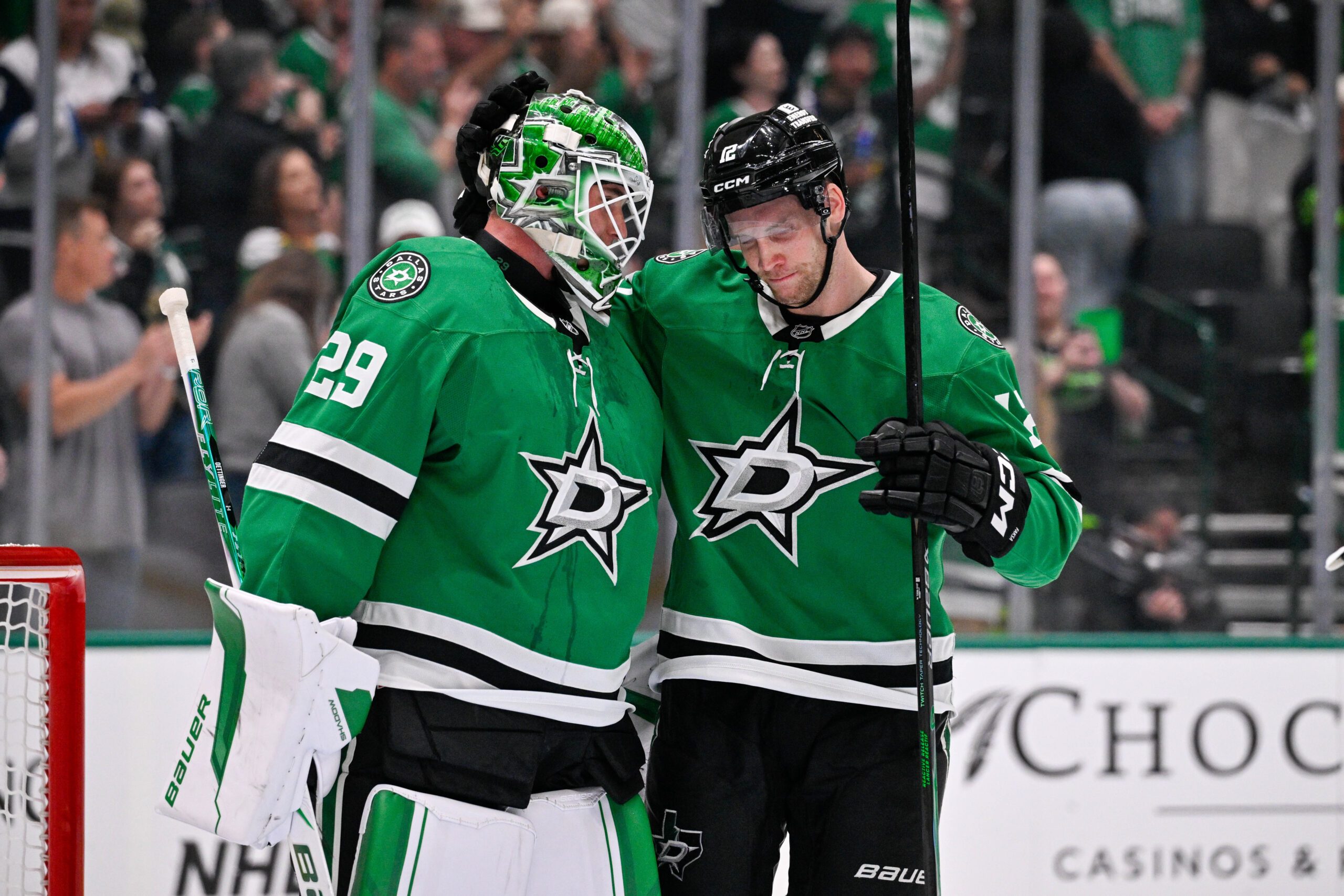 Oct 14, 2025; Dallas, Texas, USA; Dallas Stars goaltender Jake Oettinger (29) and center Radek Faksa (12) celebrate during the game between the Dallas Stars and the Minnesota Wild at American Airlines Center. Mandatory Credit: Jerome Miron-Imagn Images