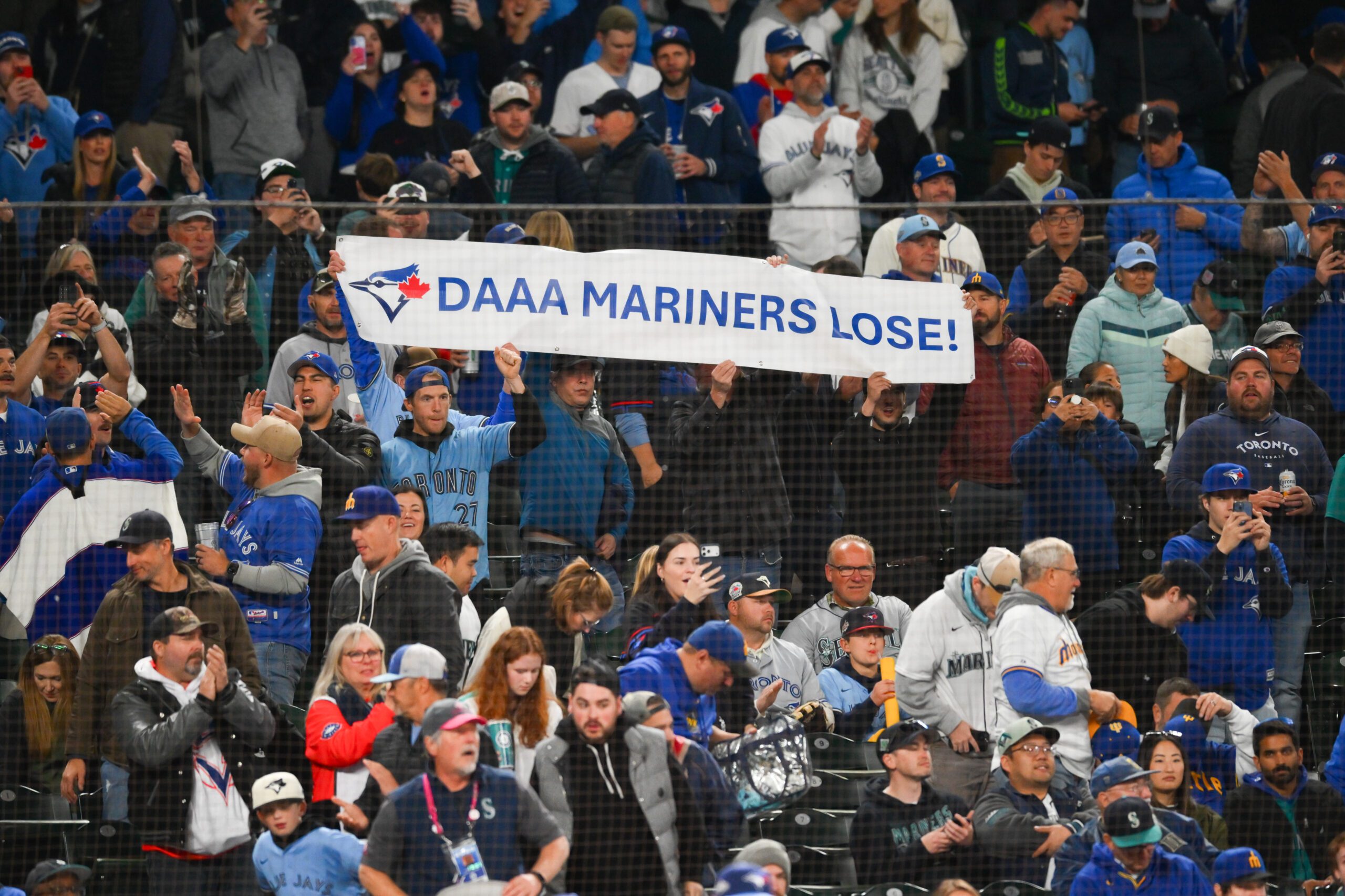 Oct 15, 2025; Seattle, Washington, USA; Toronto Blue Jays fans celebrate after the game against the Seattle Mariners during game three of the ALCS round for the 2025 MLB playoffs at T-Mobile Park. Mandatory Credit: Steven Bisig-Imagn Images