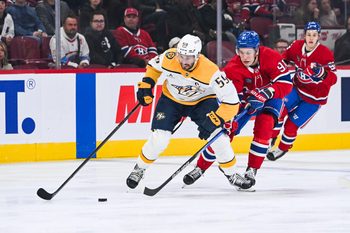 Oct 16, 2025; Montreal, Quebec, CAN; Montreal Canadiens center Oliver Kapanen (91) defends against Nashville Predators defenseman Roman Josi (59) during the first period at Bell Centre. Mandatory Credit: David Kirouac-Imagn Images