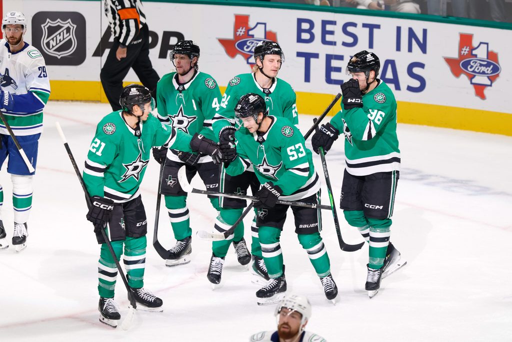 Oct 16, 2025; Dallas, Texas, USA; Dallas Stars center Wyatt Johnston (53) celebrates with teammates after scoring a goal against the Vancouver Canucks during the third period at American Airlines Center. Mandatory Credit: Chris Jones-Imagn Images