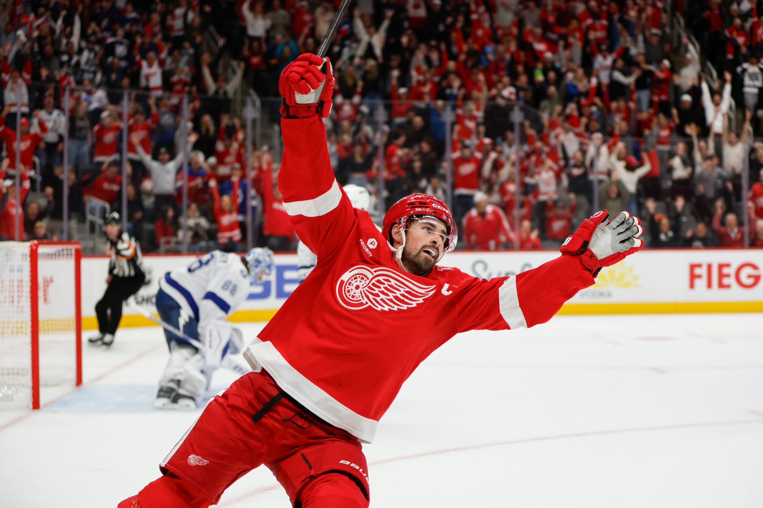Oct 17, 2025; Detroit, Michigan, USA; Detroit Red Wings center Dylan Larkin (71) scores the game winning goal in overtime against Tampa Bay Lightning goaltender Andrei Vasilevskiy (88) at Little Caesars Arena. Mandatory Credit: Brian Bradshaw Sevald-Imagn Images