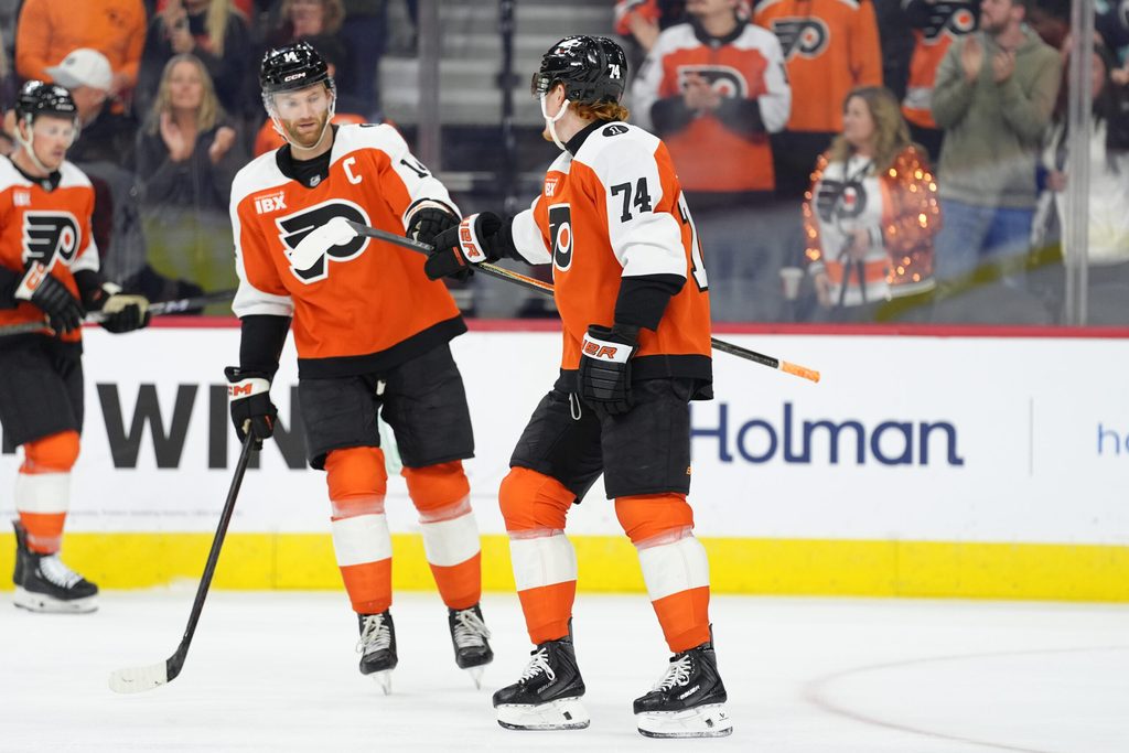 Oct 20, 2025; Philadelphia, Pennsylvania, USA; Philadelphia Flyers right wing Owen Tippett (74) reacts with center Sean Couturier (14) after scoring a goal against the Seattle Kraken in the first period at Xfinity Mobile Arena. Mandatory Credit: Kyle Ross-Imagn Images