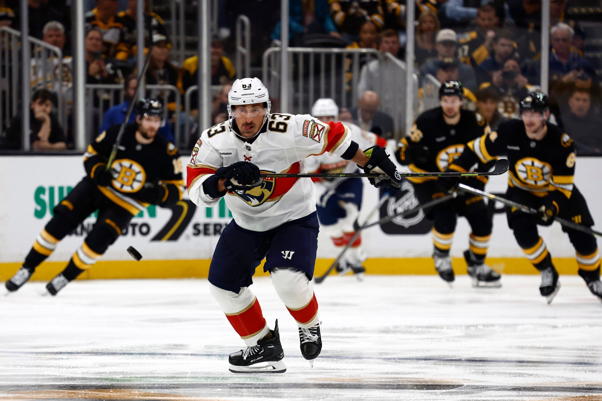 Oct 21, 2025; Boston, Massachusetts, USA; Florida Panthers left wing Brad Marchand (63) chases a loose puck against the Boston Bruins during the third period at TD Garden. Mandatory Credit: Winslow Townson-Imagn Images