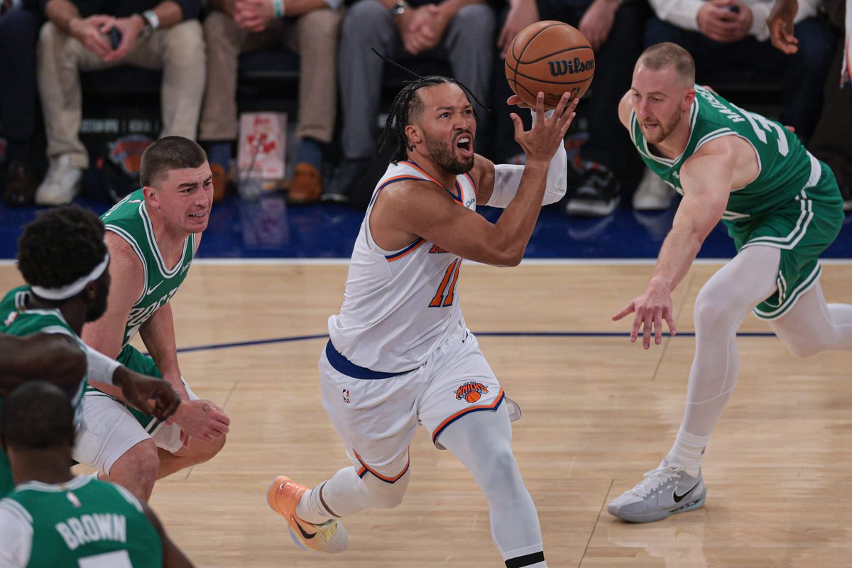 Oct 24, 2025; New York, New York, USA; New York Knicks guard Jalen Brunson (11) goes to the basket in front of Boston Celtics forward Sam Hauser (30) during the first quarter at Madison Square Garden. Mandatory Credit: Vincent Carchietta-Imagn Images