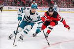 Oct 24, 2025; Newark, New Jersey, USA; San Jose Sharks center Philipp Kurashev (96) skates with the puck as New Jersey Devils right wing Timo Meier (28) defends during the third period at Prudential Center. Mandatory Credit: Ed Mulholland-Imagn Images