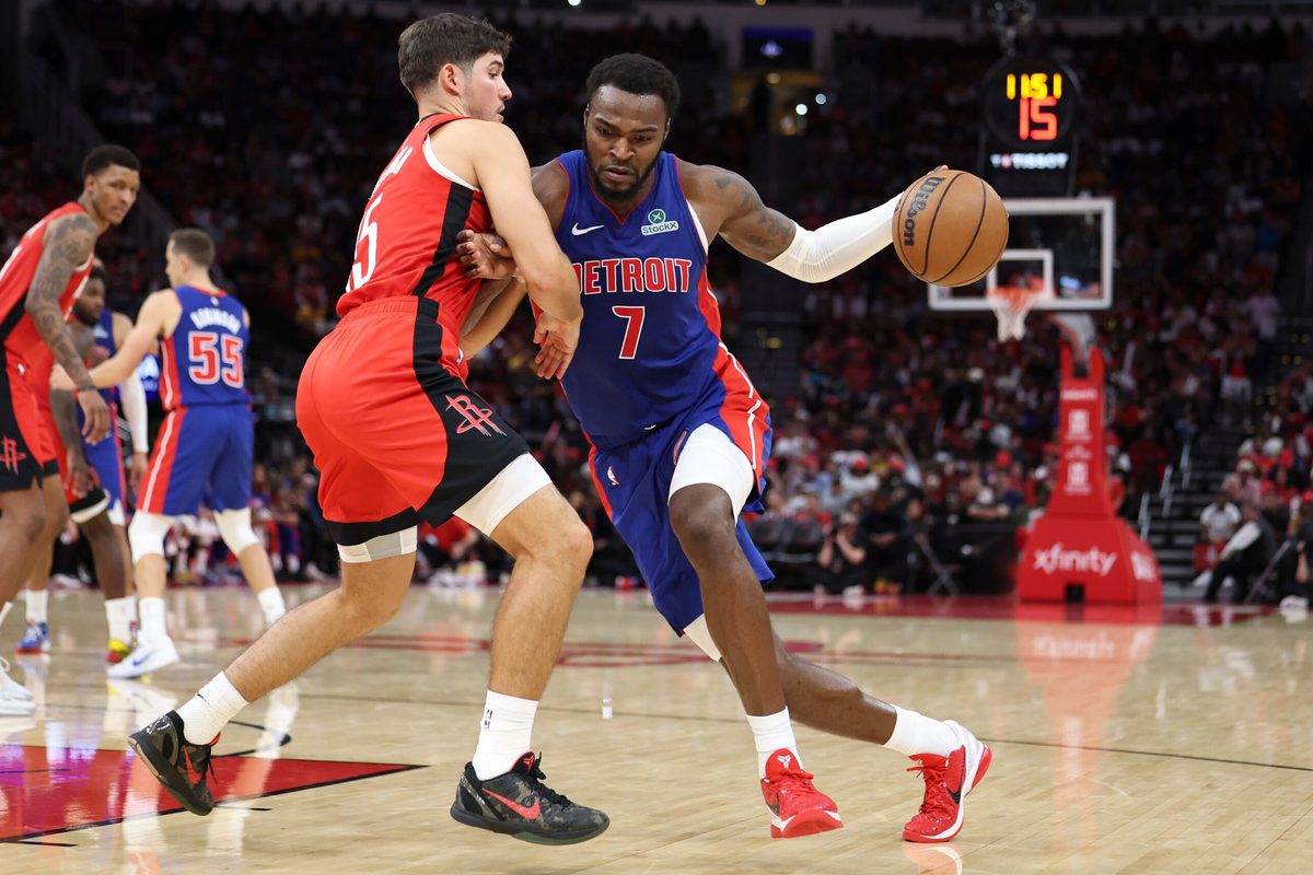 Oct 24, 2025; Houston, Texas, USA; Detroit Pistons forward Paul Reed (7) drives with the ball as Houston Rockets guard Reed Sheppard (15) defends during the fourth quarter at Toyota Center. Mandatory Credit: Troy Taormina-Imagn Images
