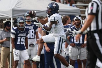 Oct 25, 2025; Houston, Texas, USA; UConn Huskies wide receiver Skyler Bell (1) makes a reception during the second quarter against the Rice Owls at Rice Stadium. Mandatory Credit: Troy Taormina-Imagn Images