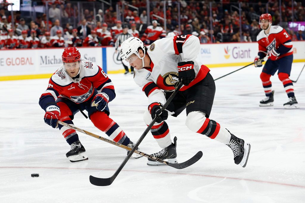 Oct 25, 2025; Washington, District of Columbia, USA; Ottawa Senators center Shane Pinto (12) skates with the puck against as Washington Capitals defenseman Jakob Chychrun (6) chases during the second period at Capital One Arena. Mandatory Credit: Geoff Burke-Imagn Images