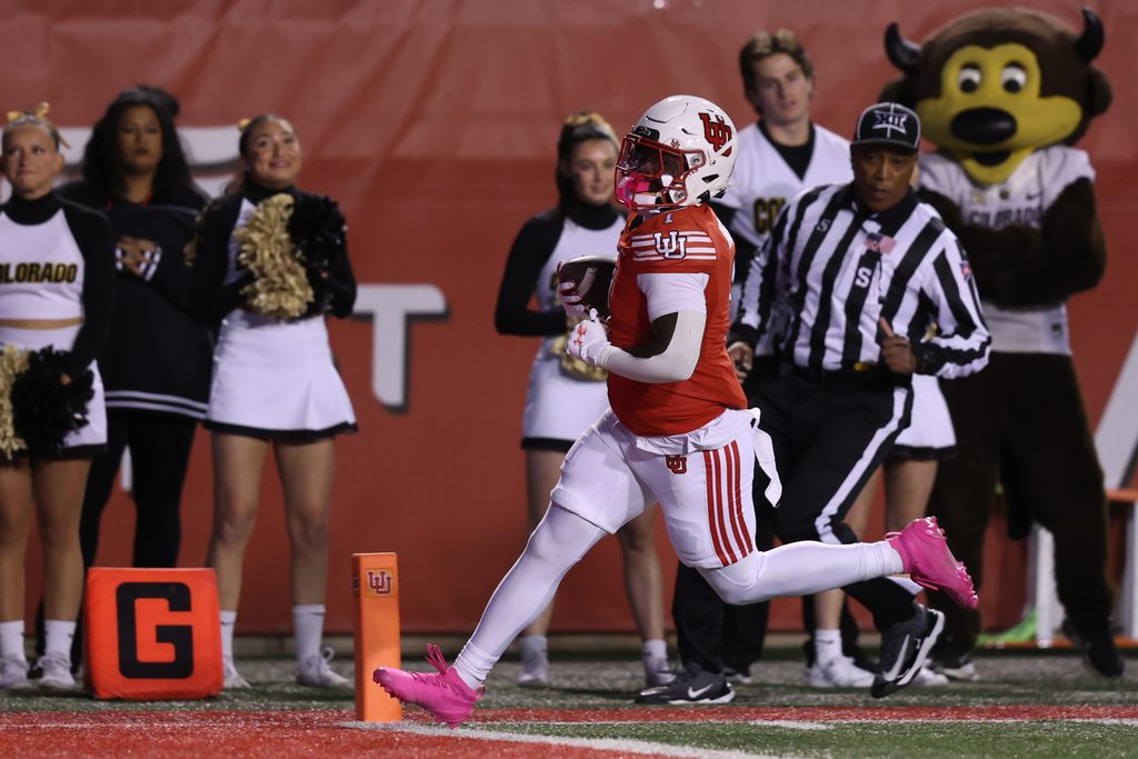 Oct 25, 2025; Salt Lake City, Utah, USA; Utah Utes running back Wayshawn Parker (1) runs the ball for a touchdown against the Colorado Buffaloes during the first quarter at Rice-Eccles Stadium. Mandatory Credit: Rob Gray-Imagn Images
