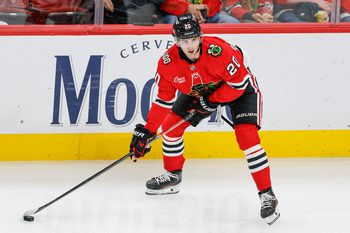 Oct 26, 2025; Chicago, Illinois, USA; Chicago Blackhawks center Ryan Greene (20) looks to pass the puck against the Los Angeles Kings during the second period at United Center. Mandatory Credit: Kamil Krzaczynski-Imagn Images