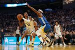 Oct 27, 2025; San Francisco, California, USA; Memphis Grizzlies guard Ja Morant (12) holds onto the ball next to Golden State Warriors forward Jimmy Butler III (10) in the second quarter at the Chase Center. Mandatory Credit: Cary Edmondson-Imagn Images