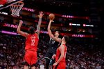 Oct 27, 2025; Houston, Texas, USA; Brooklyn Nets forward Michael Porter Jr. (17) shoots inside against Houston Rockets forward Tari Eason (17) during the third quarter at Toyota Center. Mandatory Credit: Erik Williams-Imagn Images