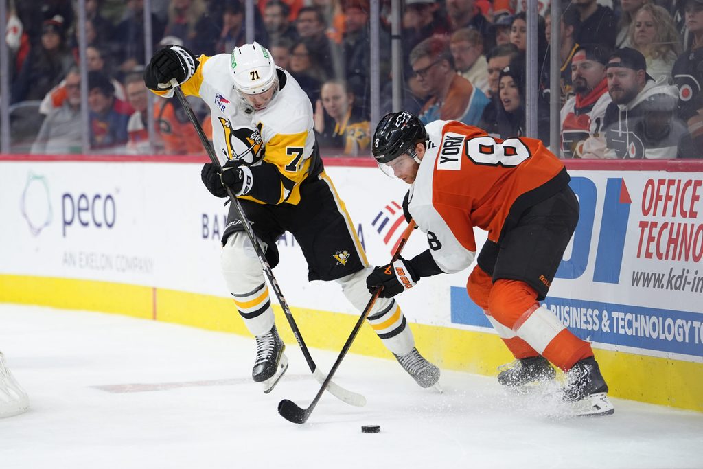 Oct 28, 2025; Philadelphia, Pennsylvania, USA; Pittsburgh Penguins center Evgeni Malkin (71) and Philadelphia Flyers defenseman Cam York (8) battle for the puck in overtime at Xfinity Mobile Arena. Mandatory Credit: Kyle Ross-Imagn Images